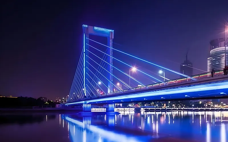 Bridge lighting design creating water reflection and mirror effects in river and waterfront environments
