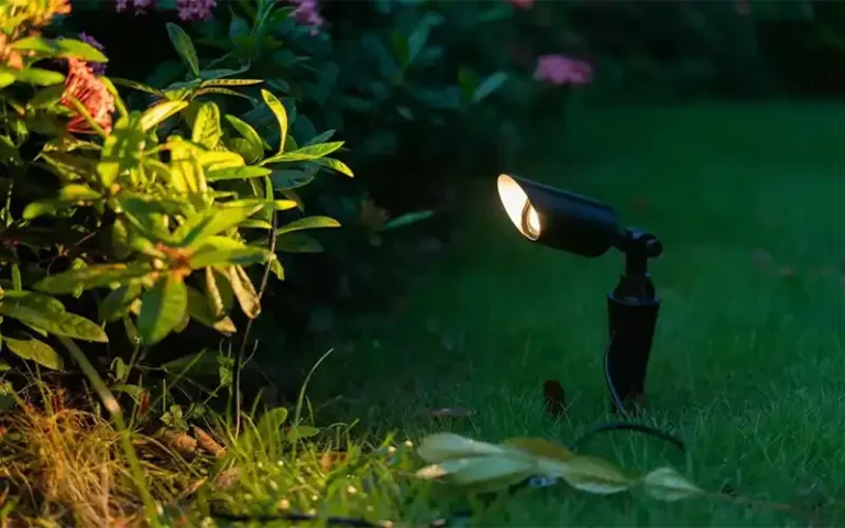 LED spike light installed in garden landscape illuminating plants and pathways