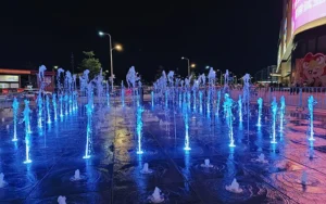 Outdoor LED fountain lights creating colorful water feature lighting effect