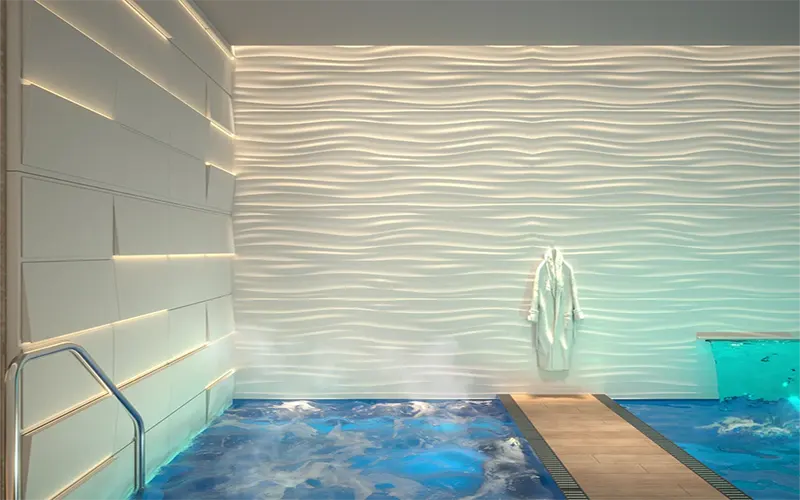 wall grazer lighting effect highlighting textured wall surface in architectural lighting