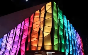Architectural facade lighting design at night showcasing dynamic illumination on commercial building