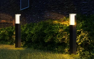 Bollard light spacing along an outdoor pathway for balanced illumination