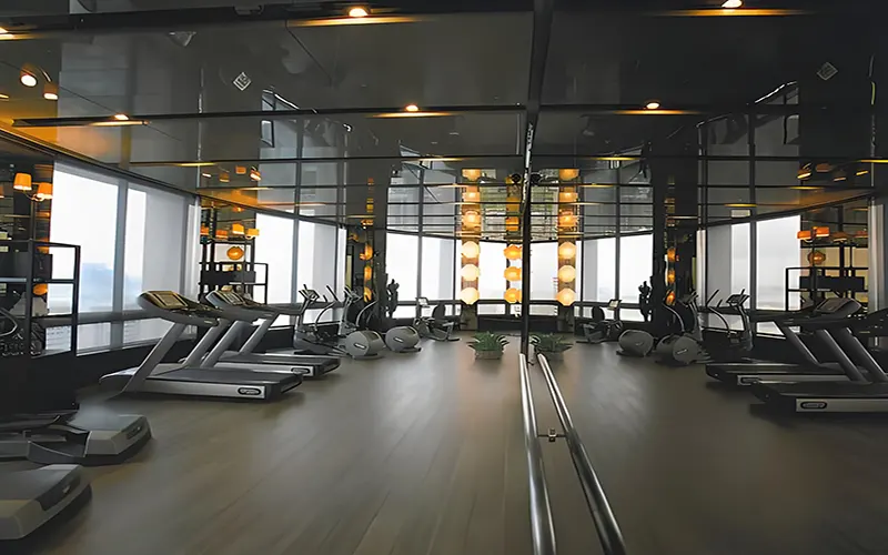 High Bay vs Low Bay Lighting Gym Example: Using low bay lighting fixtures for even illumination in a fitness center
