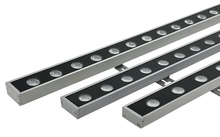 Outdoor LED wall washer illuminating architectural building facade with even color lighting