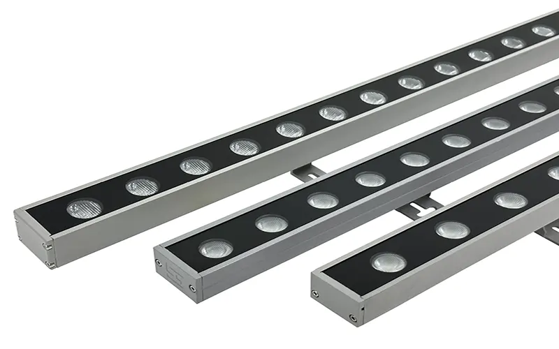 Outdoor LED wall washer illuminating architectural building facade with even color lighting